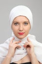 Young woman eastern type in the modern Muslim clothes and beautiful headdress Royalty Free Stock Photo