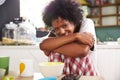 Portrait Of Young Woman Eating Breakfast In Kitchen Royalty Free Stock Photo