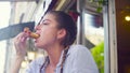 Portrait of young woman eating cookie Royalty Free Stock Photo