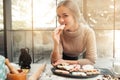 Portrait of young woman eating cookie heart Royalty Free Stock Photo