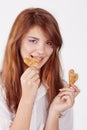 Portrait of young woman eating cookie Royalty Free Stock Photo