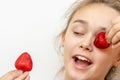 Portrait of young woman eating strawberries. Healthy happy smiling woman eating strawberry.