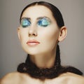 Portrait of young woman with fashion make up with blue eye. Beau Royalty Free Stock Photo