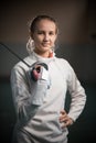 A portrait of a young woman fencer with a singlestick