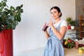 portrait of young woman with glass of detox drink looking