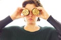 Portrait of young woman having fun making funny things with vegetables and meat