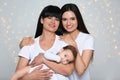 Portrait of young woman, her baby and mature mother Royalty Free Stock Photo