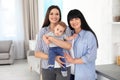 Portrait of young woman, her baby and mature mother Royalty Free Stock Photo