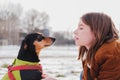 Portrait of a young woman and her lovely dachshund dog.