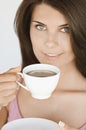 Portrait of young woman holding cup of tea with lemon Royalty Free Stock Photo