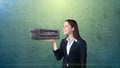 Portrait of young woman holding 3D leather sofa on the open hand palm, over isolated studio background. Business concept