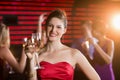 Portrait of young woman holding a glass of champagne Royalty Free Stock Photo