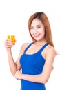 Portrait of young woman holding glass of orange juice Royalty Free Stock Photo