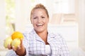 Portrait of young woman holding lemons in hand Royalty Free Stock Photo