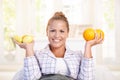 Portrait of young woman holding lemons in hands Royalty Free Stock Photo