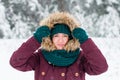 Portrait of a young woman in a hood