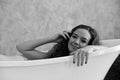 Portrait of a young woman laying in bathtub.relaxed time in bathroom