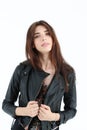 Portrait of young woman in leather jacket