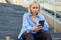 Portrait of young woman looking with pity and compassion at smartphone camera, staring at something heart-breaking on Royalty Free Stock Photo