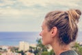 Portrait of a young woman looking at a sea landscape Royalty Free Stock Photo