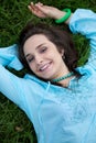 Portrait of young woman lying on grass Royalty Free Stock Photo