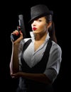 Portrait of young woman in manly style with gun Royalty Free Stock Photo