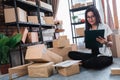 Asian woman check shipping packages