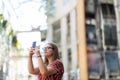 Young woman taking photo with her smart phone Royalty Free Stock Photo