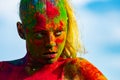 Portrait of young woman with paint make-up. Color face with colorful holi splash. Concept for Indian festival Holi. Royalty Free Stock Photo