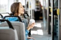 Female passenger using public transport Royalty Free Stock Photo