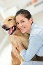 Portrait of young woman petting her dog Royalty Free Stock Photo