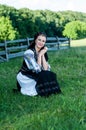 Portrait of young woman posing in Romanian traditional