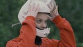 Portrait young woman in protective helmet slow motion. Girl in helmet on head