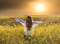 Portrait of a young woman in a rapeseed field Royalty Free Stock Photo