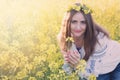 Portrait of a young woman in a rapeseed field Royalty Free Stock Photo