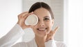 Portrait of young woman recommend moisturizing facial cream Royalty Free Stock Photo