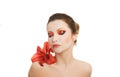 Portrait of young woman with red lily flower Royalty Free Stock Photo