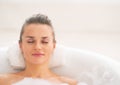 Portrait of young woman relaxing in bathtub Royalty Free Stock Photo