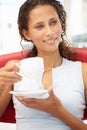 Portrait of young woman relaxing with cup of tea Royalty Free Stock Photo