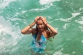 Portrait young woman relaxing at tropical coral reef beach on Indian ocean Royalty Free Stock Photo