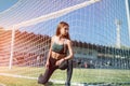 Portrait of a young woman resting after exercising  or run on stadium. Fitness and healthy lifestyle concept Royalty Free Stock Photo