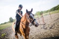 Portrait of young woman riding horse in countryside Royalty Free Stock Photo