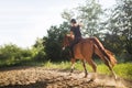 Portrait of young woman riding horse in countryside Royalty Free Stock Photo