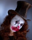 Portriat of a Young woman ins scary clown make up. Royalty Free Stock Photo