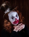 Portriat of a Young woman ins scary clown make up. Royalty Free Stock Photo