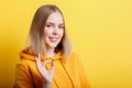 Portrait young woman shows ok hand gesture. Teenage blonde calm smiling girl shows positive ok gesture symbol like and Royalty Free Stock Photo