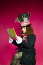 Portrait of young woman in the similitude of the Hatter ( Royalty Free Stock Photo