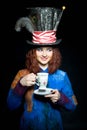 Portrait of young woman in the similitude of the Hatter ( Royalty Free Stock Photo