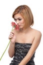 Portrait of a young woman smelling a flower Royalty Free Stock Photo