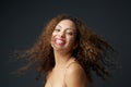 Portrait of a young woman smiling with curly hair Royalty Free Stock Photo